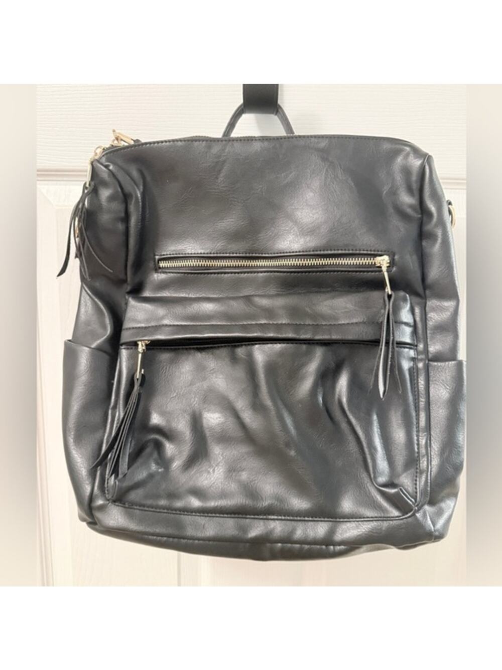Black Leather Modern + Chic Bag backpack EUC. Lined w/purple. Looks New!